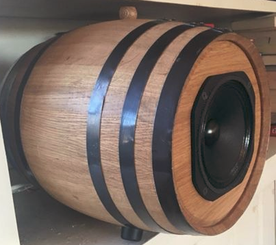 full range speakers in beer barrel on shelf